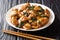 Three Cup Chicken, is a classic Taiwanese dish made by cookingÂ chickenÂ with sesame oil, soy sauce and rice wine close-up in a